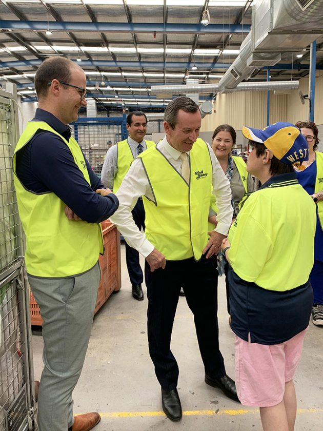 Good Sammy employee Deb, speaking with the Premier and Member for Jandakot, with Good Sammy team smiling in the background.