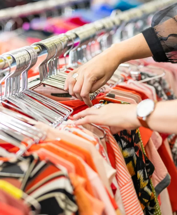 Donated clothes on free standing clothes rack